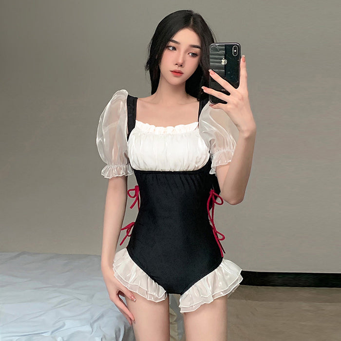 Wholesale Swimsuit with lotus leaf edge connected triangular mesh splicing design, with a niche feel