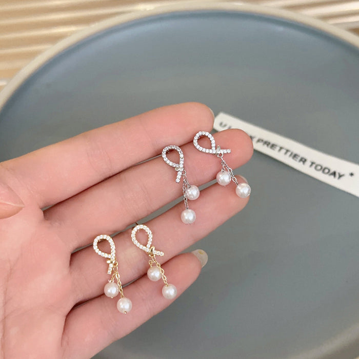 Wholesale Pearl zircon bow tassel silver needle earrings with high-end feel, new temperament earrings
