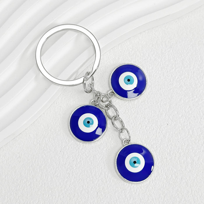Wholesale Diamond-encrusted blue eyes evil eye tassel keychain