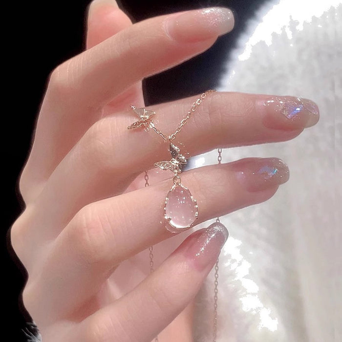 Wholesale Pure silver powder crystal droplet butterfly necklace for women, light luxury, niche, high-end design, collarbone chain