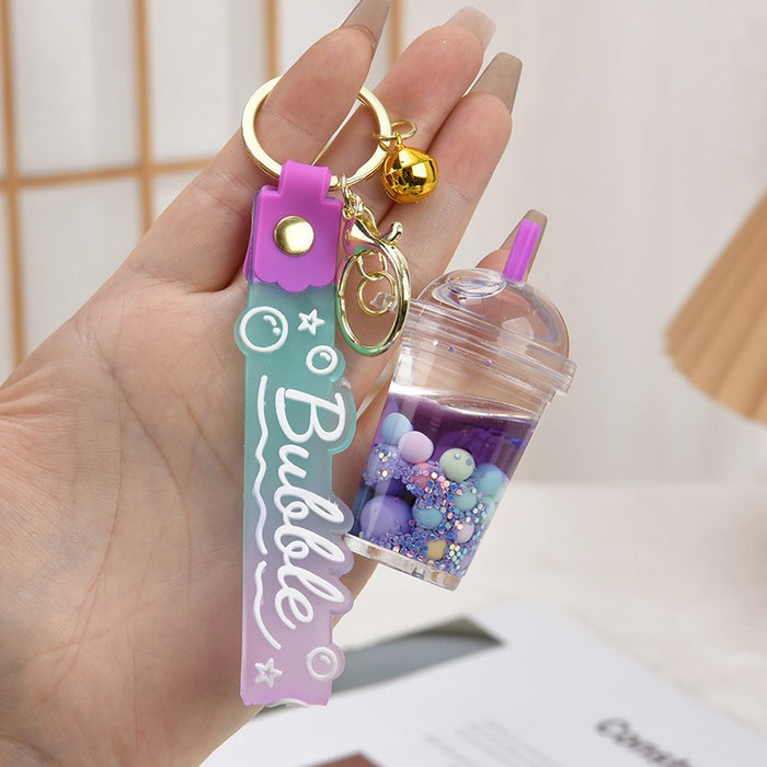 Wholesale Acrylic oil bottle candy Bean astronaut keychain