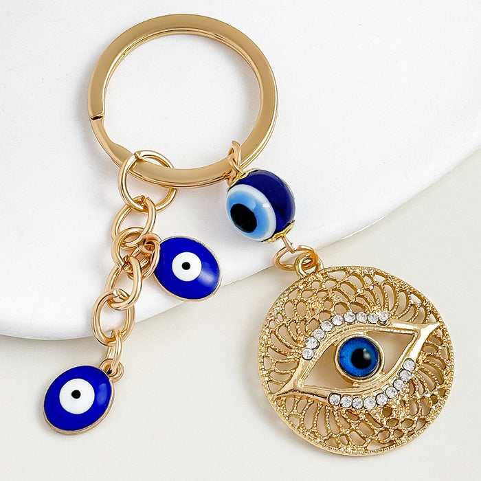 Wholesale Diamond-encrusted blue eyes evil eye tassel keychain