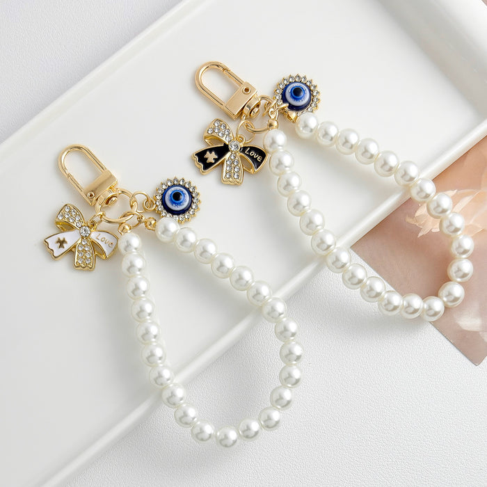 Wholesale Pearl chain beaded mobile phone lanyard bow pendant keychain