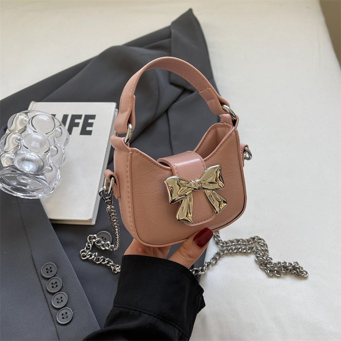 Wholesale New retro oil leather handbag with shiny bow and chain crossbody bag