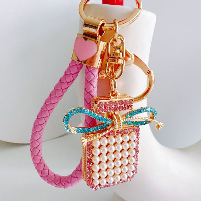 Wholesale Alloy Diamond Tassel Bow Pearl Perfume Bottle Keychain JDC-KC-ZhanLun017