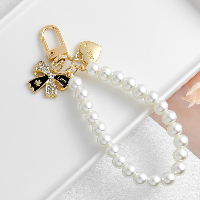 Wholesale Pearl chain beaded mobile phone lanyard bow pendant keychain