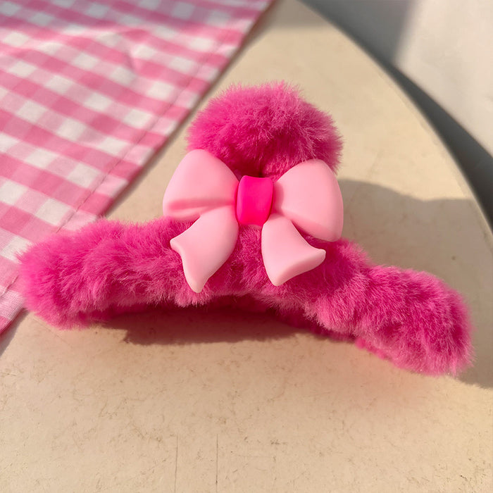 Wholesale Dopamine inducing plush hair claw clip with a cute pink bow