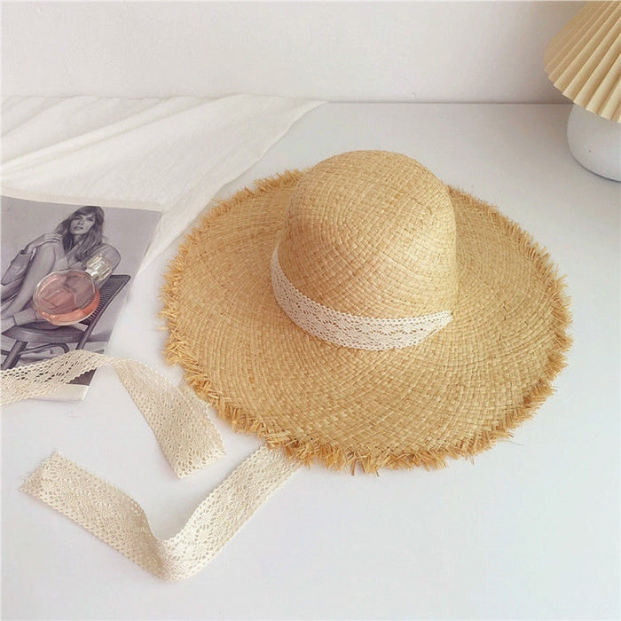 Wholesale Big brim frayed Lafite grass hat women's beach hat for beach vacation, sun protection and sunshade hat