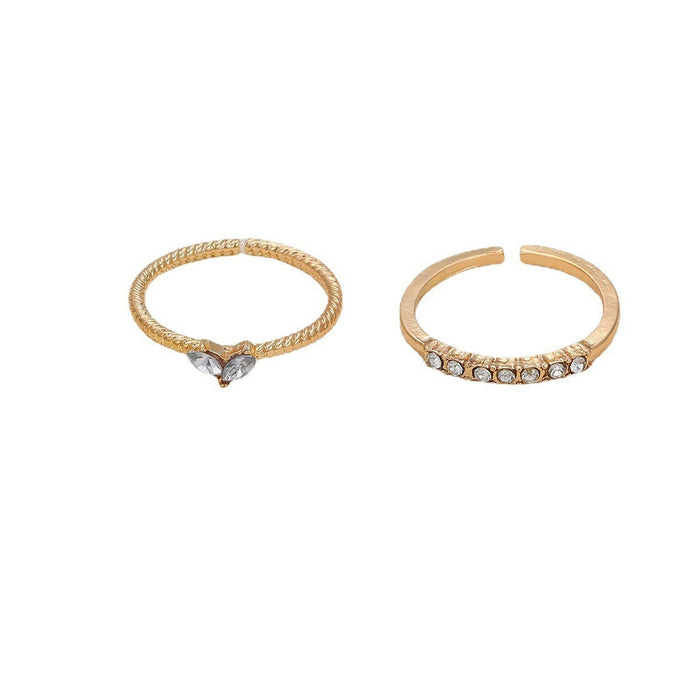 Wholesale Set of open-faced diamond-encrusted heart-shaped rings.
