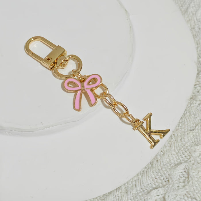 Wholesale Pink bow A-Z keychain alloy accessory