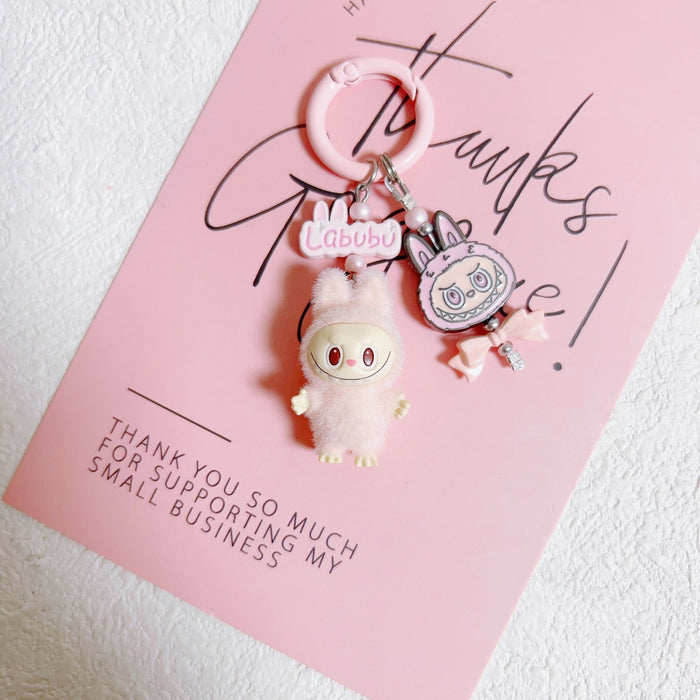 Wholesale Doll Enamel Sitting Posture Cute Mobile Phone Pendant Keychain