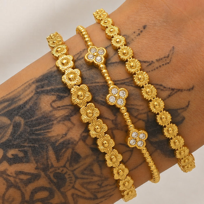 Wholesale Women S Titanium Steel Bracelet Featuring Three Flowers Four Leaf Clover With Electroplated Finish For Everyday Fashion Accessory