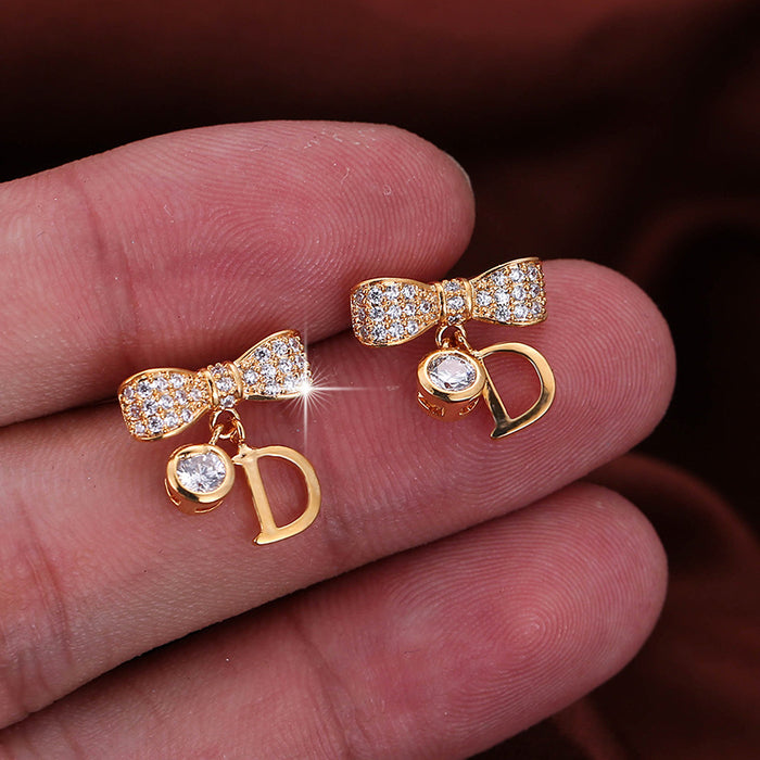 Jewelry WholesaleWholesale metal geometric bow letter stud earrings JDC-ES-Dingy007 Earrings 鼎煜 %variant_option1% %variant_option2% %variant_option3%  Factory Price JoyasDeChina Joyas De China