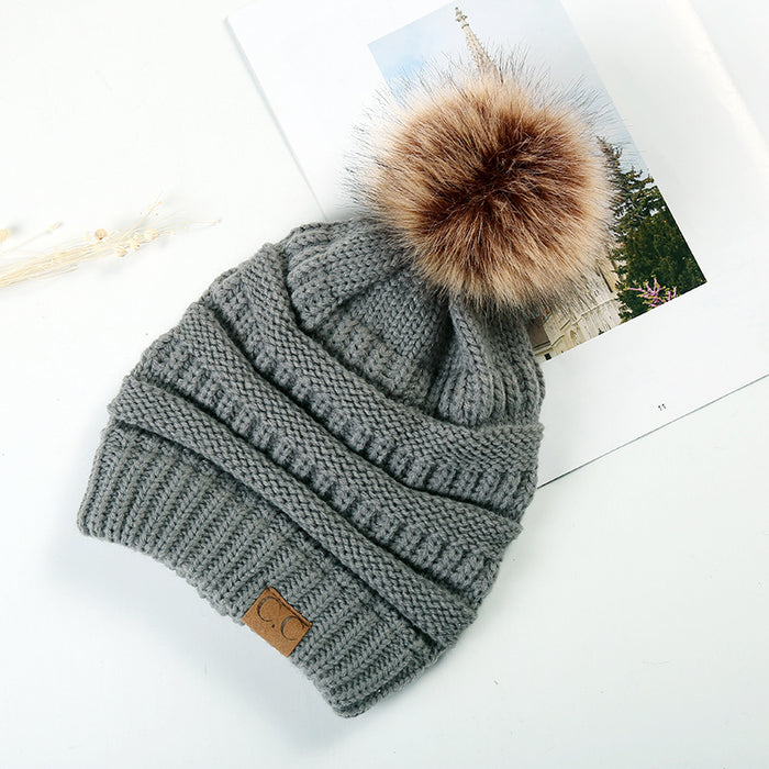 Wholesale Ponytail and Wool Ball Knitted Warm and Thick Wool Hats JDC-FH-HengYu001