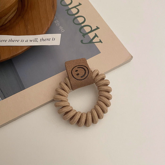 Wholesale earth color milk tea telephone wire hair ring rubber band JDC-HS-Qianq002