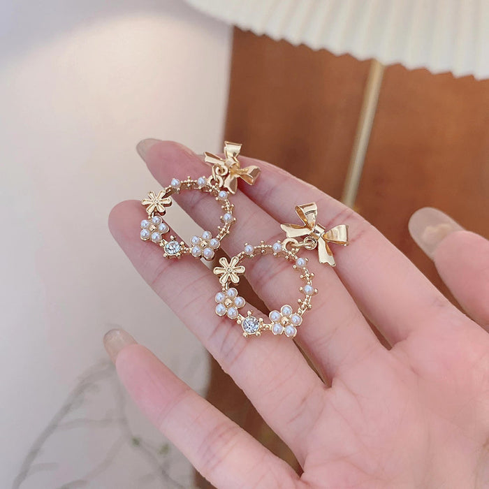 Wholesale Earrings Alloy Bow Pearl Cutout JDC-ES-AiMei020