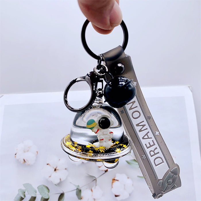 Wholesale Keychains For Backpacks personality black gold dream astronaut spaceship into oil keychain MOQ≥2 JDC-KC-DMF012