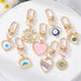 Jewelry WholesaleWholesale Dot Drill Carved Alloy Love Eye Keychain MOQ≥6 JDC-KC-Juej006 Keychains 觉际 %variant_option1% %variant_option2% %variant_option3%  Factory Price JoyasDeChina Joyas De China