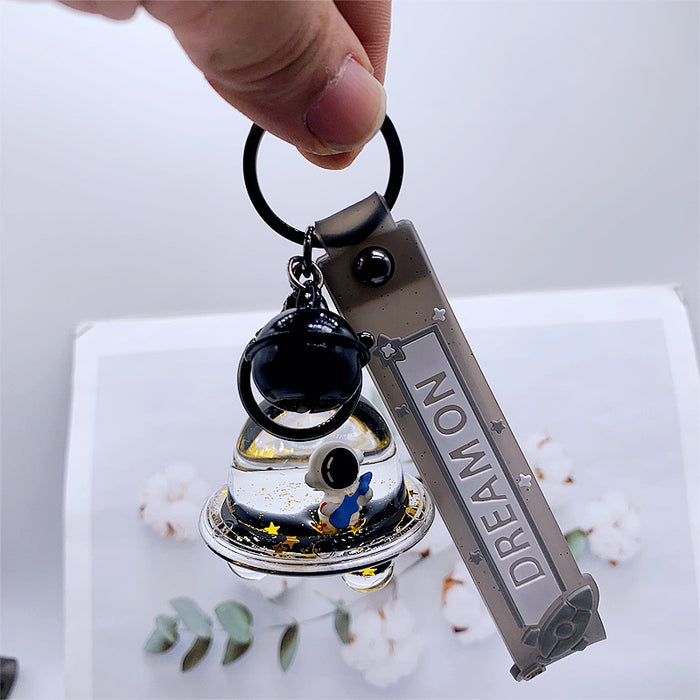 Wholesale Keychains For Backpacks personality black gold dream astronaut spaceship into oil keychain MOQ≥2 JDC-KC-DMF012