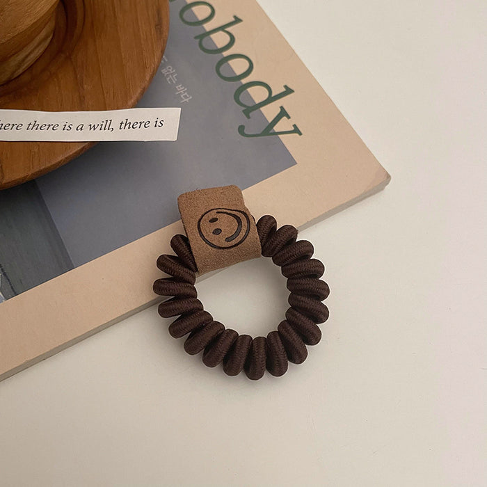 Wholesale earth color milk tea telephone wire hair ring rubber band JDC-HS-Qianq002