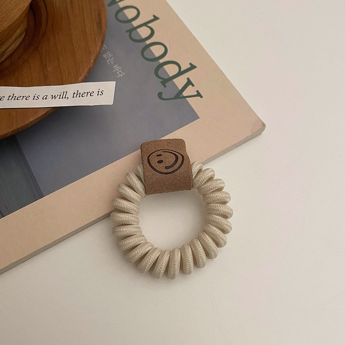 Wholesale earth color milk tea telephone wire hair ring rubber band JDC-HS-Qianq002